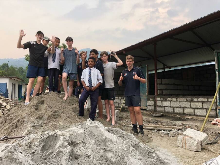 The job in Nepal by the Canberra Grammar School students involved moving 10 tonne of sand and cement.