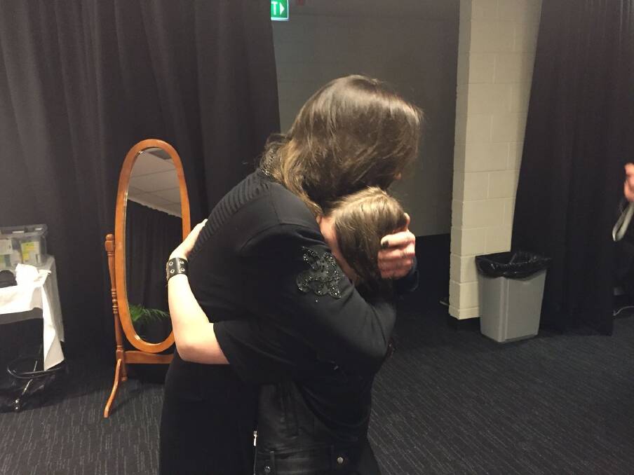 Black Sabbath frontman Ozzy Osbourne gave Callum McPhie, of Canberra, a tender hug when they met before a Black Sabbath concert in Sydney. Photo: Supplied