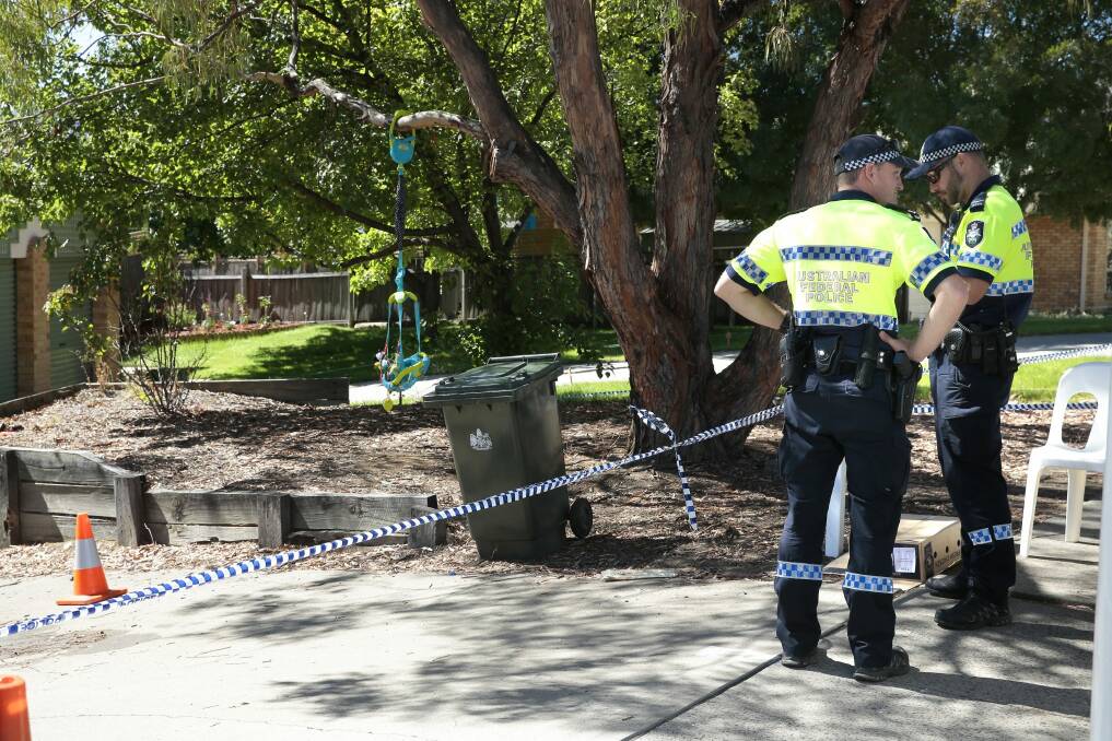 ACT Policing at the crime scene on Knoke Avenue in Gordon on Thursday. Photo: Jeffrey Chan