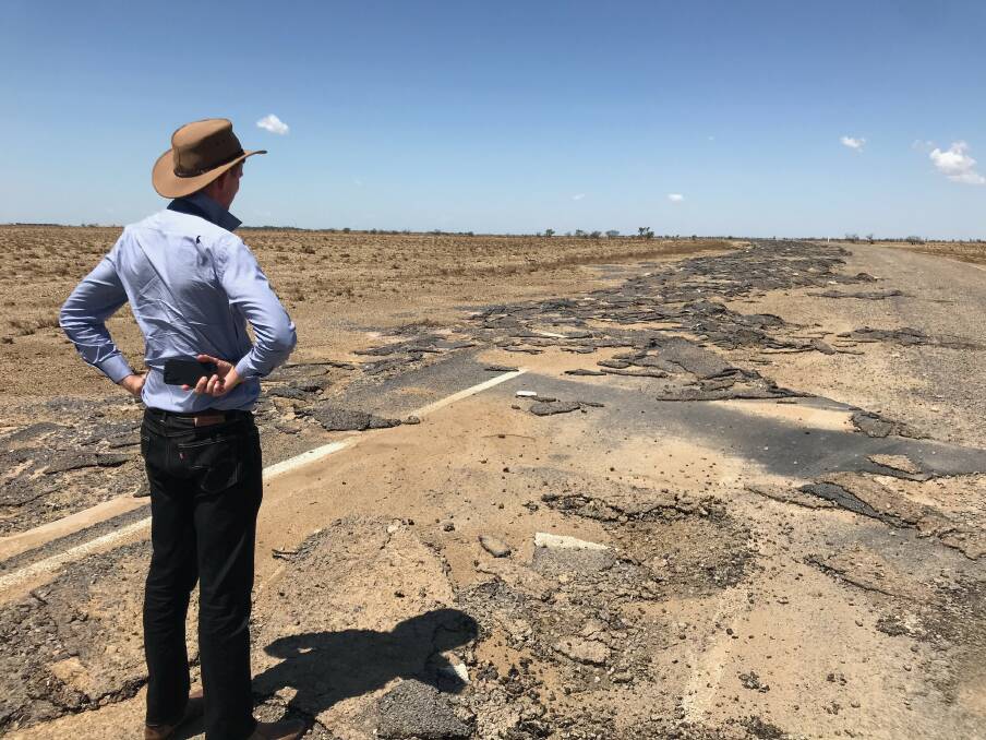 Main Roads Minister Mark Bailey inspects damage on the Flinders Highway, east of Julia Creek. Photo: Supplied