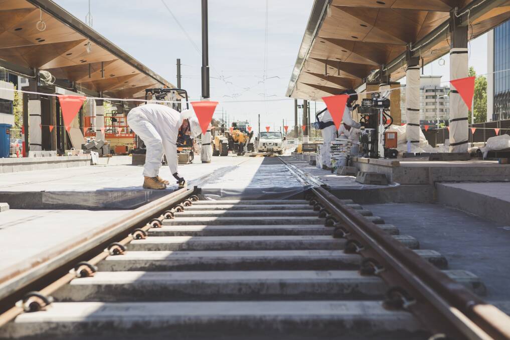 The final section of light rail being laid at the city end of the 12 kilometre line on Friday. Photo: Jamila Toderas