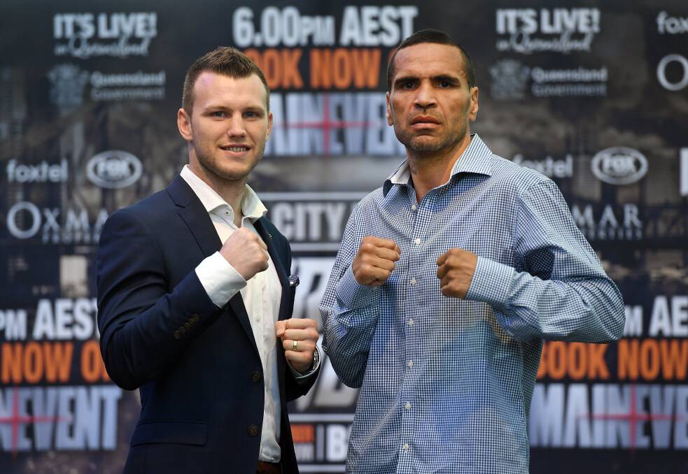 Fighting words: Jeff Horn and Anthony Mundine at the pre-bout press conference. Photo: AAP
