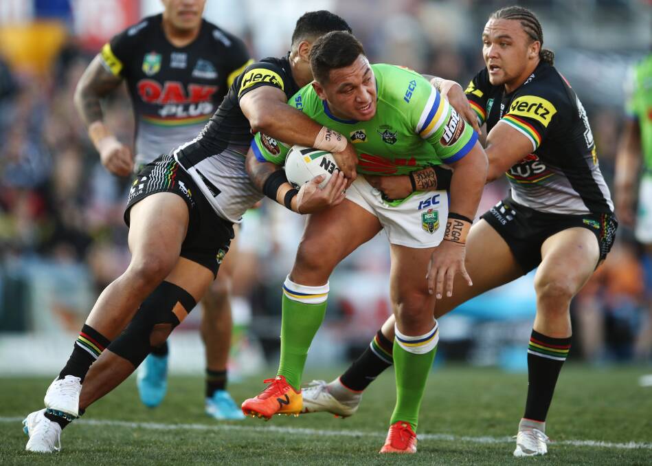 Josh Papalii is wrapped up by the Panthers' defence. Photo: AAP
