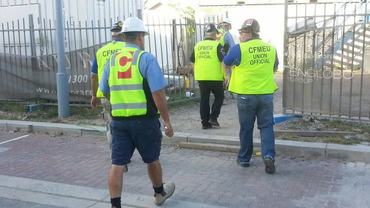CFMEU negotiators arriving at the site. Photo: Hamish Boland-Rudder