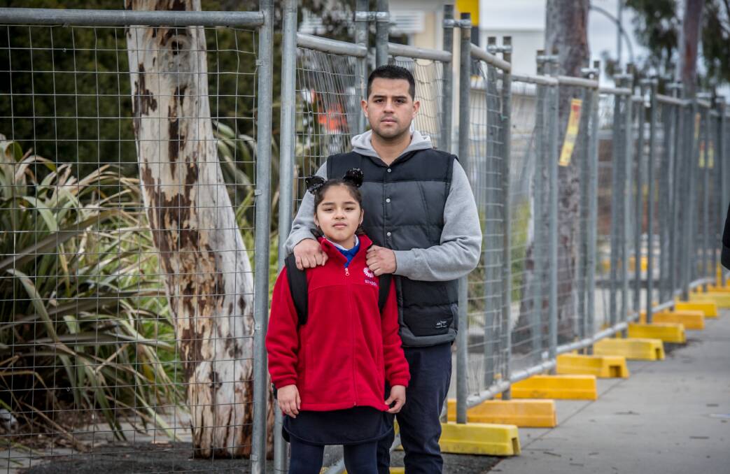 Alonso Chiok Diaz with his daughter Cielo Chiok-Medrano, 8. He says Cielo was playing in the garden beds at school the same day it was revealed asbestos had been found.  Photo: Karleen Miney