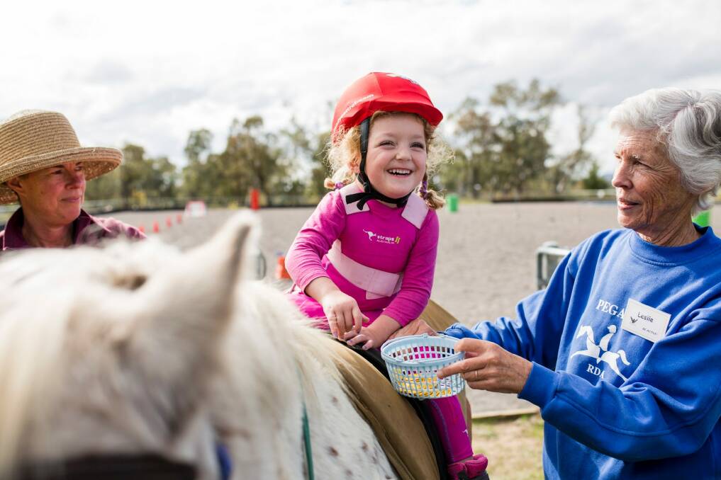 Kamea Keefe, 4, enjoys her session with Pegasus Riding for the Disabled.  Photo: Jamila Toderas