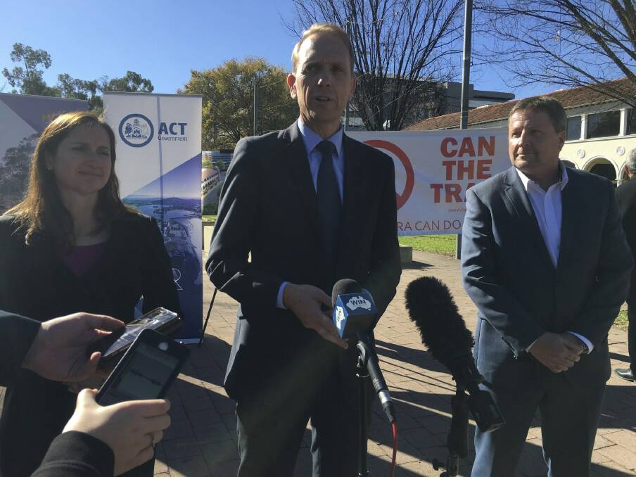 Capital Metro Minister Simon Corbell (centre) announces the signing of contracts, with Canberra Metro consortium chief executive Martin Pugh. Photo: Kirsten Lawson