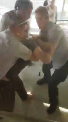 In mobile phone footage taken from inside the centre, the man is dragged away by three guards. Photo: Supplied