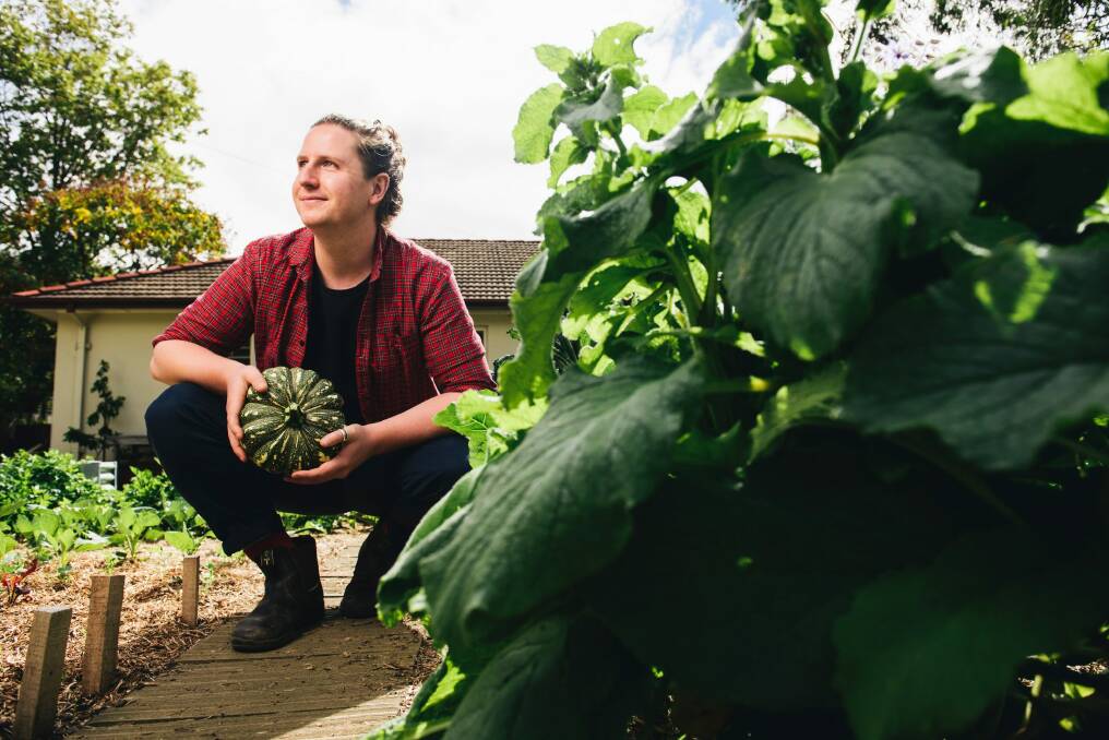 Nursing student Connor Lynch in his vegetable garden at his home in O'Connor, a garden that has helped him eat more fruit and vegetables. Photo: Rohan Thomson