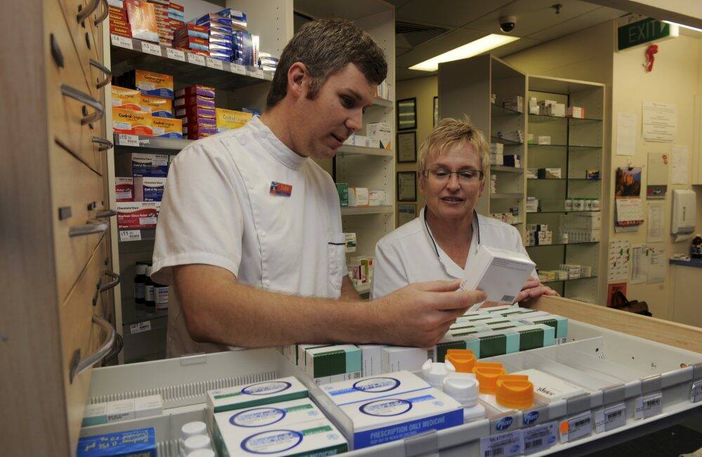 Frontline: Erindale Pharmacy has won an award for the support manager Beth Berry gives to pharmacist and reservist Luke Peacock.  Photo: Graham Tidy
