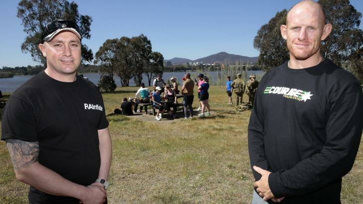Healthy exercise: James Hellyer, left, and Ian Bone take a break from the ANZAC Warriors Walk.  Current and former Navy, Army and Air Force members are walking 80km around Lake Burley Griffin to raise funds and awareness of PTSD. Photo: Jeffrey Chan.