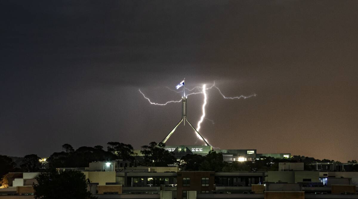 Lightning strikes over Canberra on Tuesday night as a storm front rolled through. Photo: Sitthixay Ditthavong