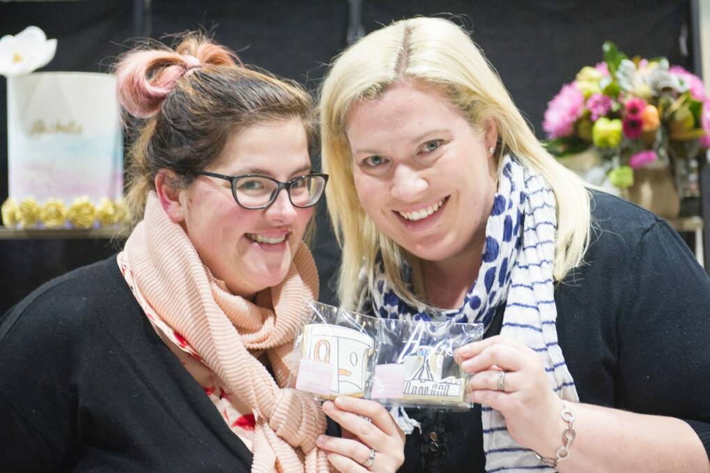 Owners of Roseberry Street Bakery, Jade Sinkovits and Lisa Johnston with their Canberra icon cookies at the Handmade Market over the weekend. Photo: Jay Cronan