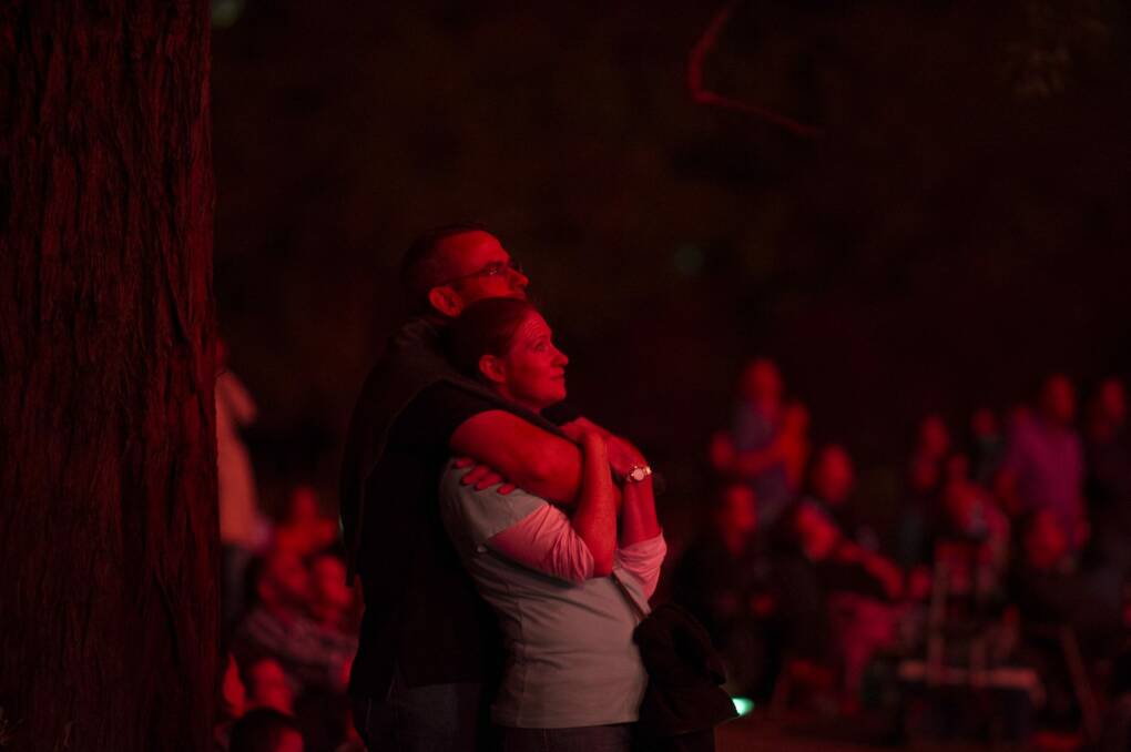 A couple watches the Skyfire celebrations at Lake Burley Griffin.  Photo: Rohan Thomson