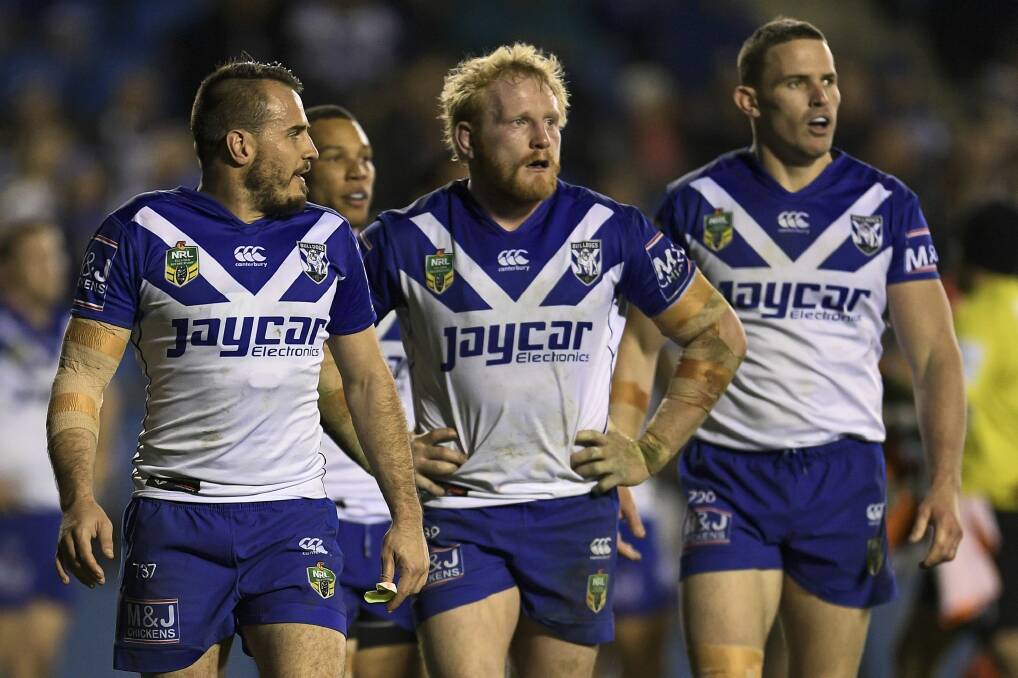 Kept on a tight leash: Bulldogs trio Josh Reynolds, James Graham and Tim Browne. Photo: Getty Images