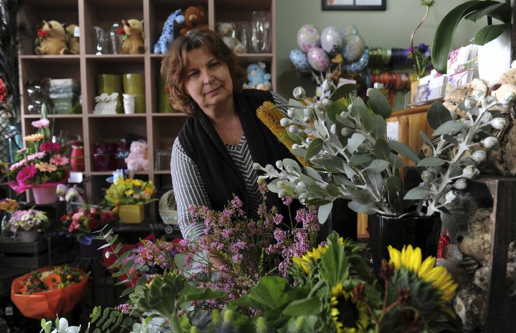 Owner of the florist shop Florever, Valerie Kivshar, is concerned about loss of business when supermarket giants Aldi and Coles are built at the Dickson shops. Photo: Graham Tidy
