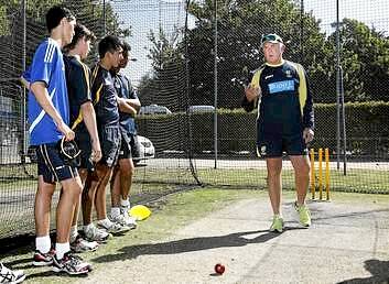 Former Australian fast bowler Craig McDermott coaching at a cricket clinic with ACT U-15 and U- 7 players at Manuka Oval on Friday. Photo: Jeffrey Chan