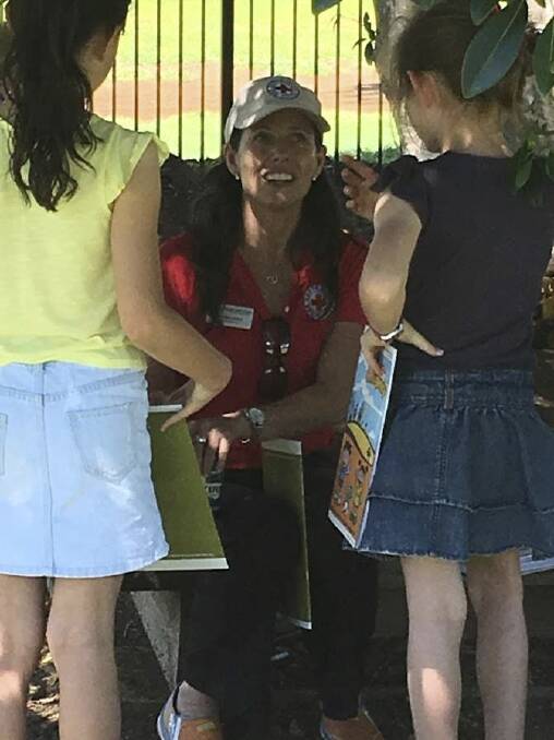 Amanda Lamont speaking with children after Tropical Cyclone Marcia in Queensland. Photo: Supplied
