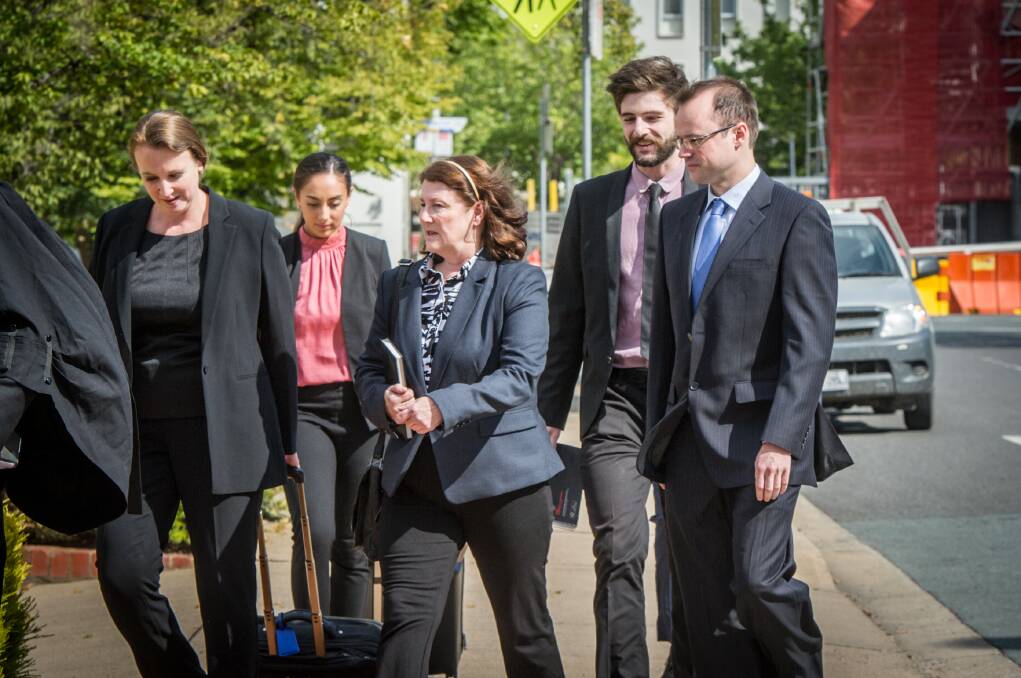 Melissa Beowulf (centre) and her sons Thorsten Halley Beowulf (far right) and Bjorn Toren Beowulf (not pictured), arrive at the ACT courts to face trial after being accused of murder. Photo: Karleen Minney