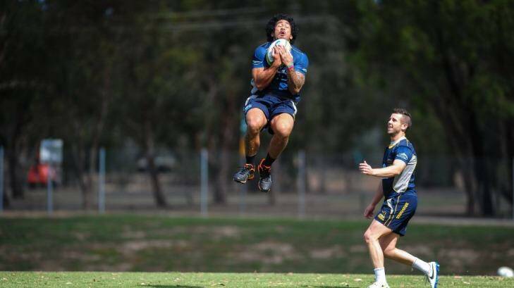 Leap of fatih: Joe Tomane, jumping left, will return to the ACT Brumbies team after being baptised last weekend.  Photo: Katherine Griffiths