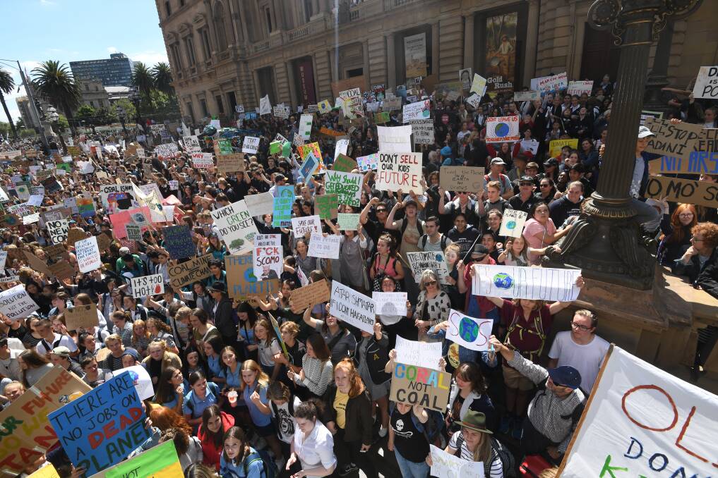 About 20,000 students fill Melbourne's CBD to protest the government's inaction on climate change. Photo: Justin McManus