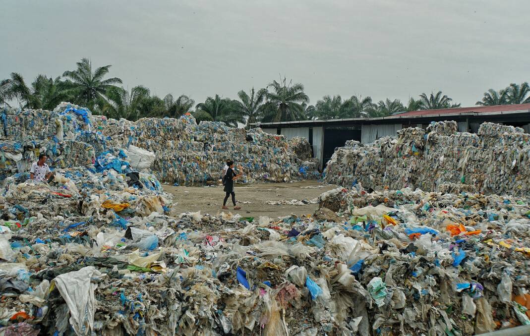 Piles of imported plastic wastes at a closed-down illegal plastic recycling factory in Jenjarom. Malaysia.  Photo: Amelia Rosa