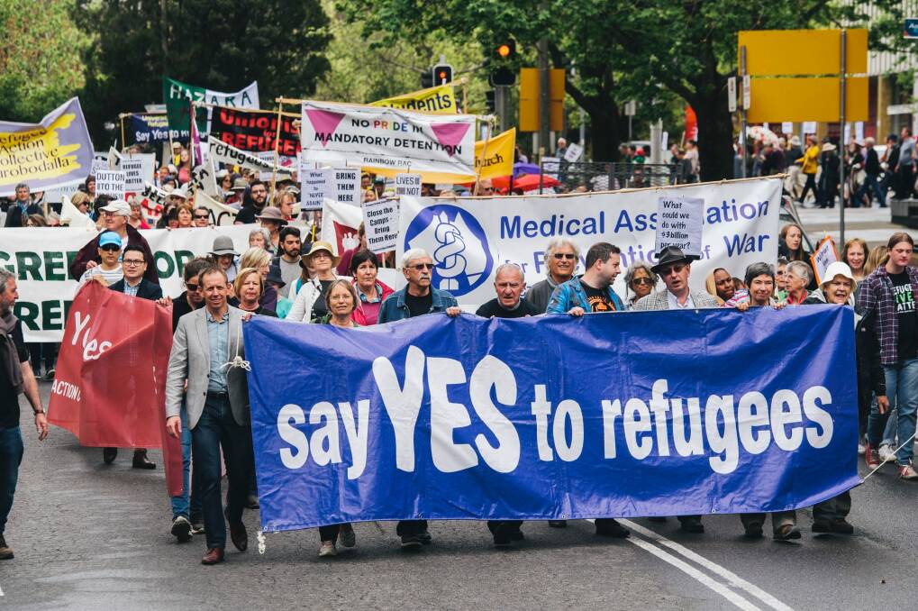 Canberrans march against Australia's fefugee policy through Civic on Sunday afternoon. Photo: Rohan Thomson