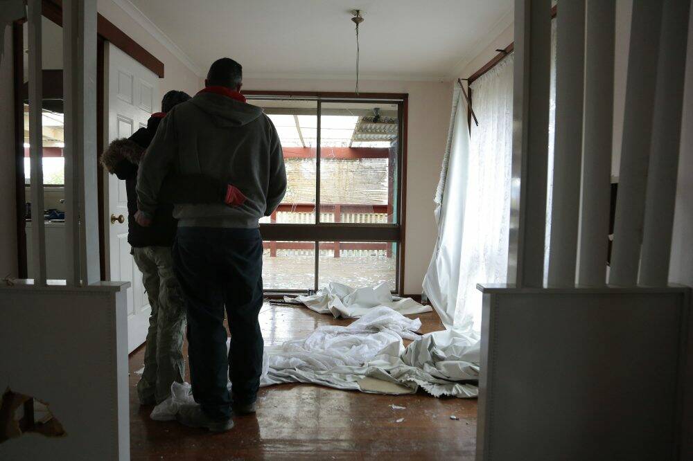 First home-buyers survey the damage to their Kambah home. Photo: Jeffrey Chan