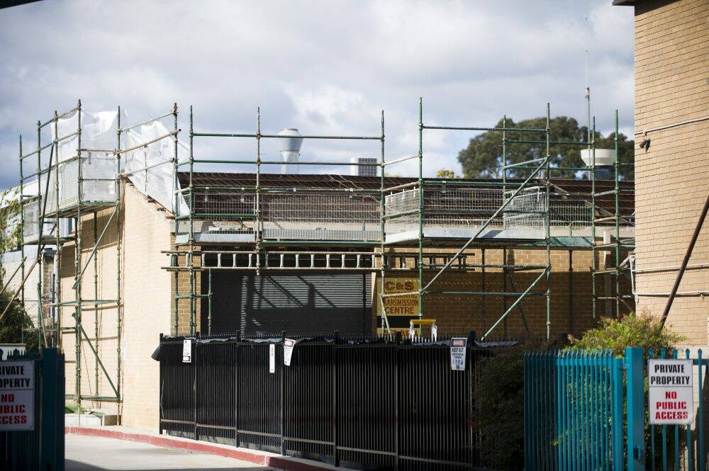Asbestos roofing removal at a site on Wooley St in Dickson. Photo: Rohan Thomson