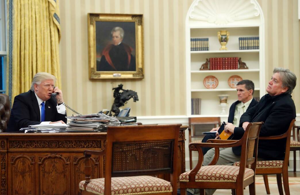 Donald Trump with Mike Flynn and Steve Bannon in the Oval Office during the call to Malcolm Turnbull. Photo: AP