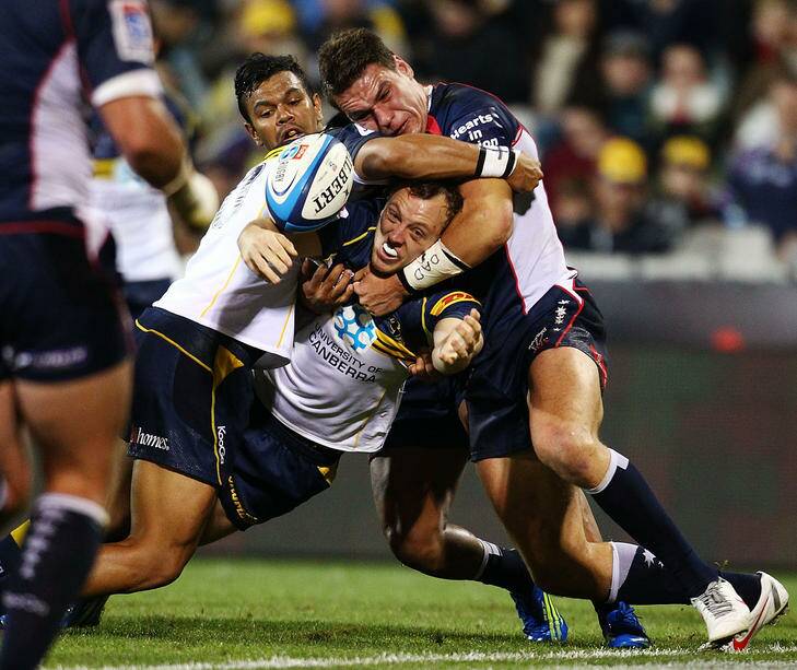 Jolted ... Jesse Mogg of the Brumbies drops the ball in the tackle. Photo: Getty Images