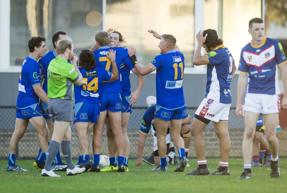 Warriors players celebrate a try against the Bushrangers. Photo: Sitthixay Ditthavong