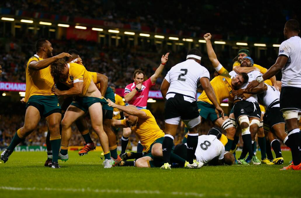 Flying start: the Wallabies open the scoring through David Pocock. Photo: Laurence Griffiths