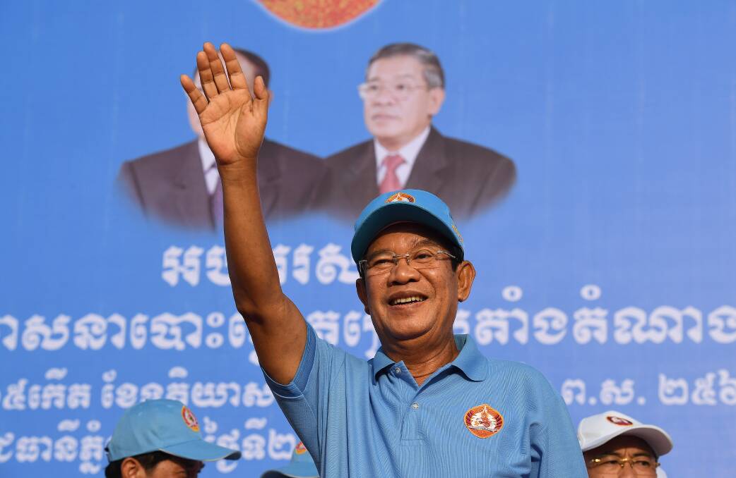Prime Minister Hun Sen greets the crowd at the last Cambodian People’s Party rally before the election. Photo: Kate Geraghty
