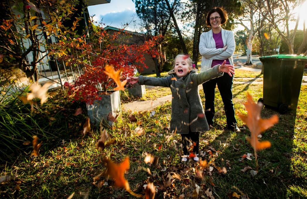 Weston Creek resident Cath Collins, pictured with daughter Sammi, 4, said she would "absolutely" opt in to have a green waste bin. Photo: Elesa Kurtz