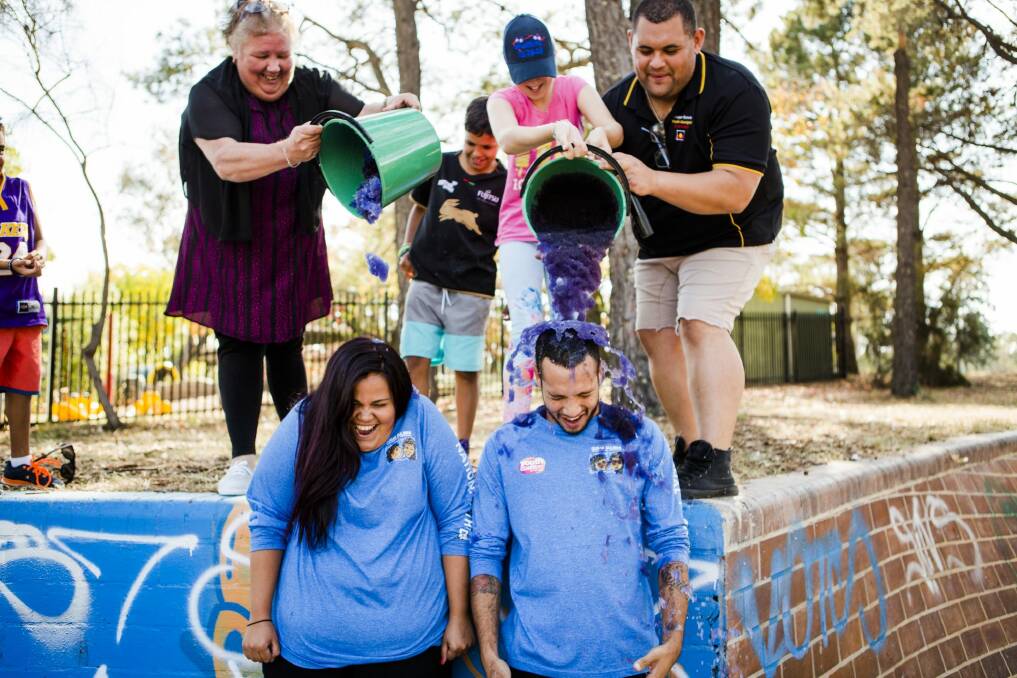 Youth worker Steven Kennedy and dual diagnosis worker Emma Cutmore had slime poured on them as part of National Youth Week celebrations. Photo: Jamila Toderas