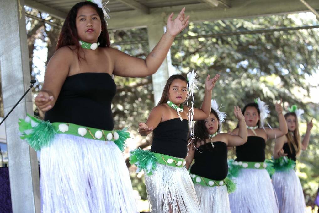 Phillinah Utia, 14, of Queanbeyan, right, and Eleni Lolesio, 9, second from right, performing with Te Uki Ou O Te Kuki Airani (The New Generations of Cook Island) dancers at Waitangi Day celebrations in Queanbeyan.    Photo: Jeffrey Chan