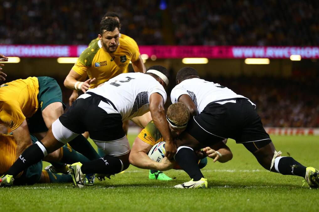 David Pocock goes over to score the opening try against Fiji. Photo: Getty Images