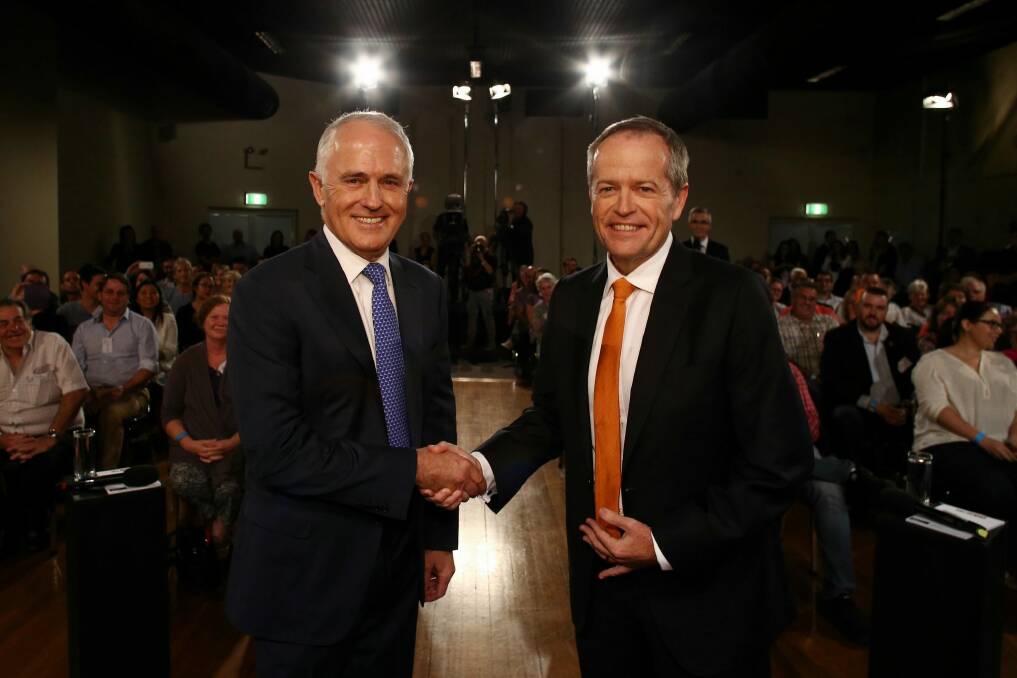 Prime Minister Malcolm Turnbull and Opposition Leader Bill Shorten shake hands at the start of the People's Forum debate at the Windsor RSL in Sydney in May. Photo: Andrew Meares