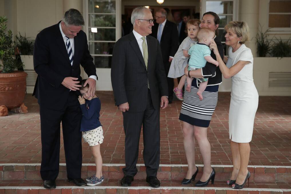 Prime Minister Malcolm Turnbull alongside Kelly O'Dwyer with children Olivia and Edward and Foreign Affairs Minister Julie Bishop in December 2017. Photo: Alex Ellinghausen