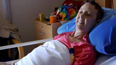 Connie proudly wears her Medal of the Order of Australia in her hospice bed in Canberra. Photo: facebook/loveyoursister