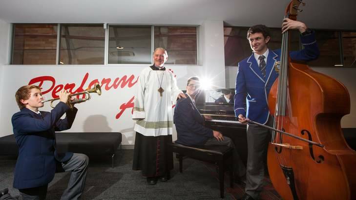 St Edmund?s College Opens their state of the art Performing Arts Centre named after Bishop Pat Power. Left: Jack Donnelly age 13 of Bungendore, Bishop Pat Power, Christopher Goddard age 14 of Campbell and Thomas Mortlock age 17 of Tuggeranong. Photo: Katherine Griffiths