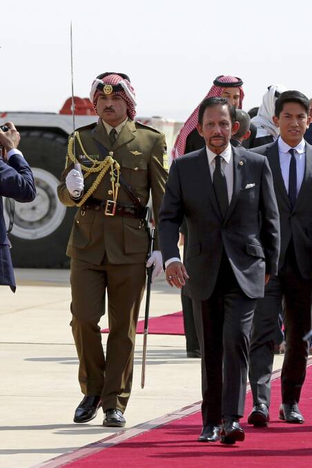 The Sultan of Brunei, Hassanal Bolkiah, was assigned several Queensland police officers as part of his security during his APEC visit. Photo: AP Photo/Raad Adayleh, Pool