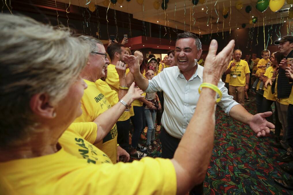 NSW Deputy Premier John Barilaro celebrates with supporters after claiming victory during his election night function at the Queanbeyan Kangaroo Leagues Club. Photo: Alex Ellinghausen
