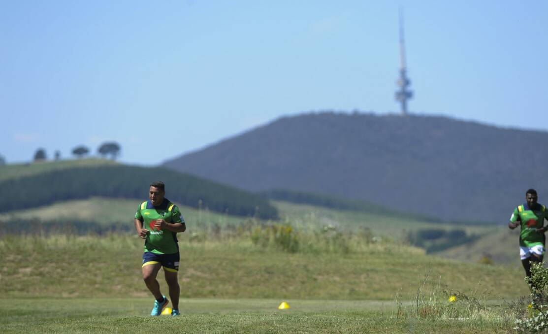 Josh Papalii and Edrick Lee on the running track at Stromlo Forest Park. Photo: Graham Tidy