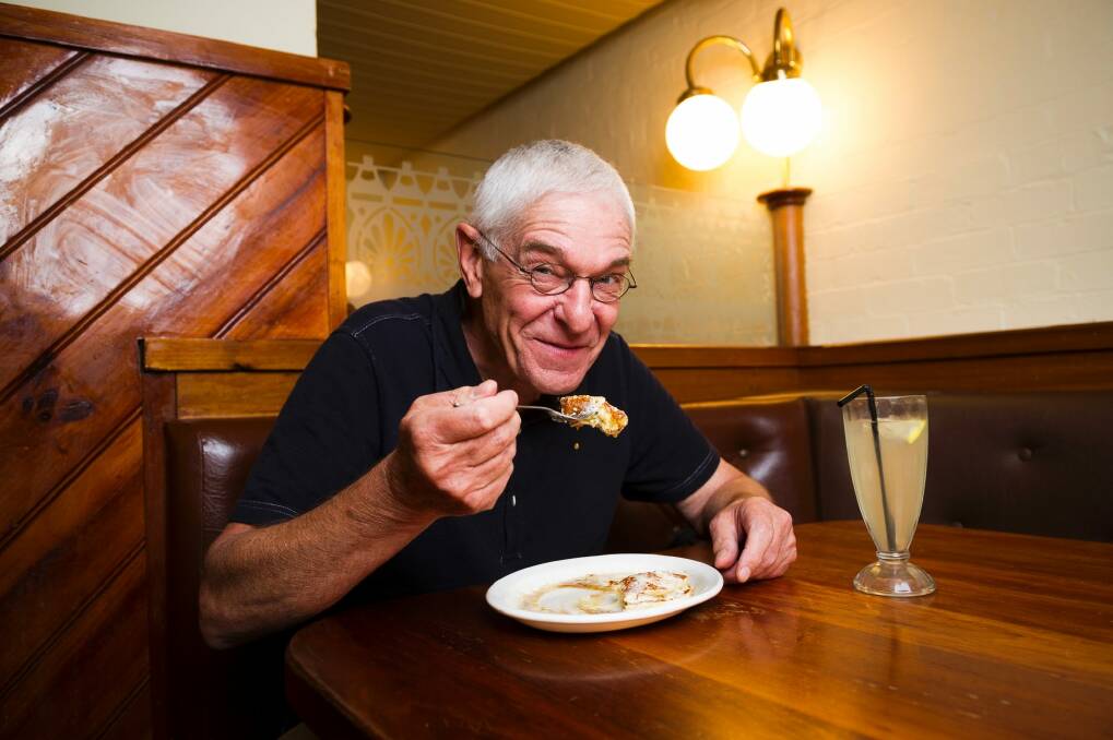 "The Original Pancake Man" Philip Barton eating pancakes that he made, topped with whipped butter and maple syrup. Photo: Dion Georgopoulos