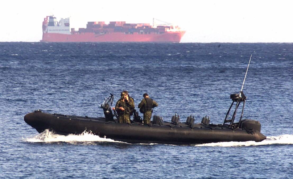 Boat-borne politics: An Australian Army vessel patrols the waters near Norwegian freighter Tampa in 2001.  Photo: AP 