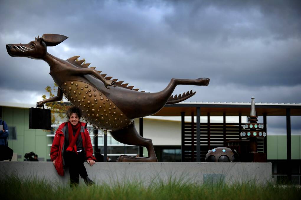 Artist Anne Ross with Gungahlin's sculpture<i>  A is for Alexander, B is for Bunyip and C is for Canberra</i>, which required $5370  of maintenance less than three years after it was unveiled. Photo: Marina Neil