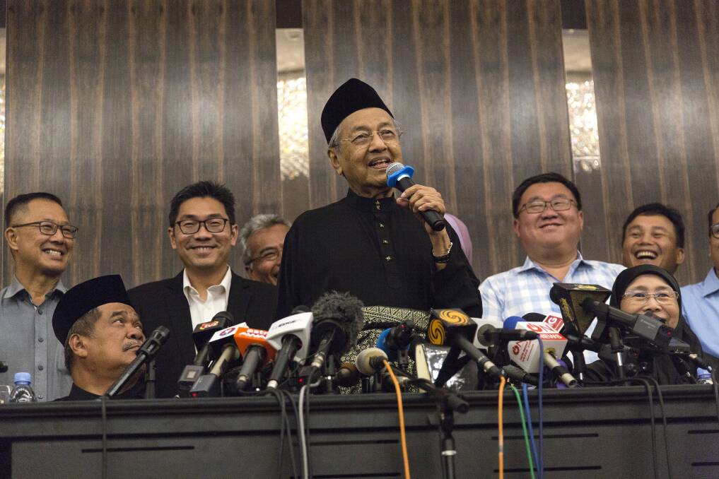 Laughter as prime minister Mahathir Mohamad addresses a news conference on Thursday. Photo: Bloomberg