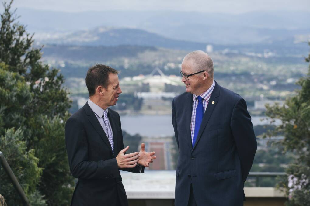 Territory and Municipal Services Minister Shane Rattenbury and National Capital Authority chief executive Malcolm Snow at the top of Mount Ainslie. Photo: Rohan Thomson